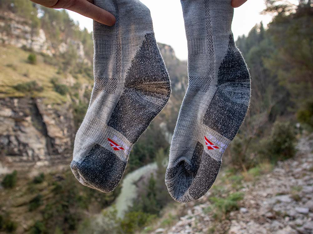 Holding Danish Endurance merino wool socks in hands