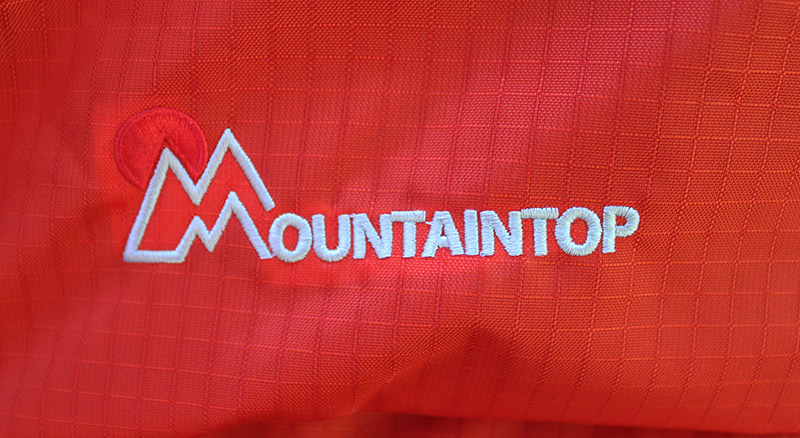 Mountaintop logo sewn on a backpack