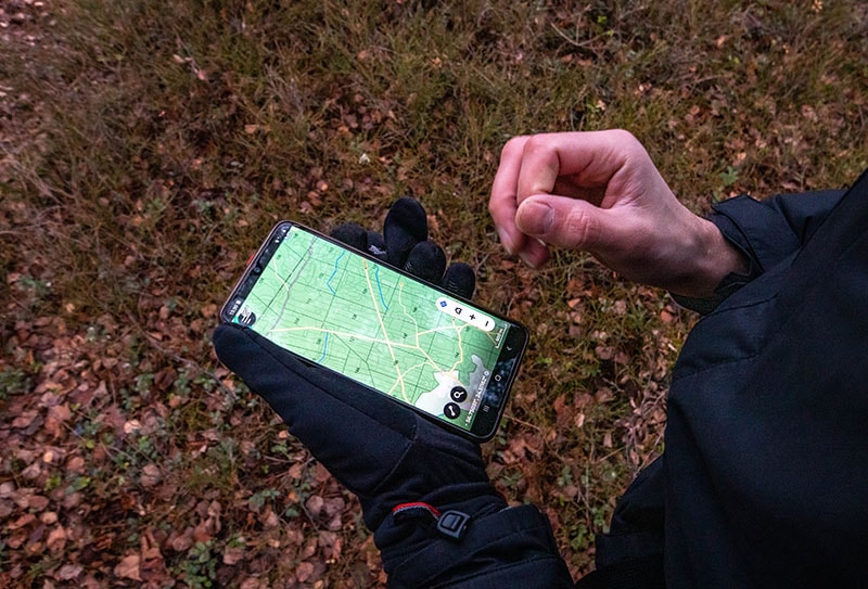Navigating while hiking with a navigation GPS app on phone