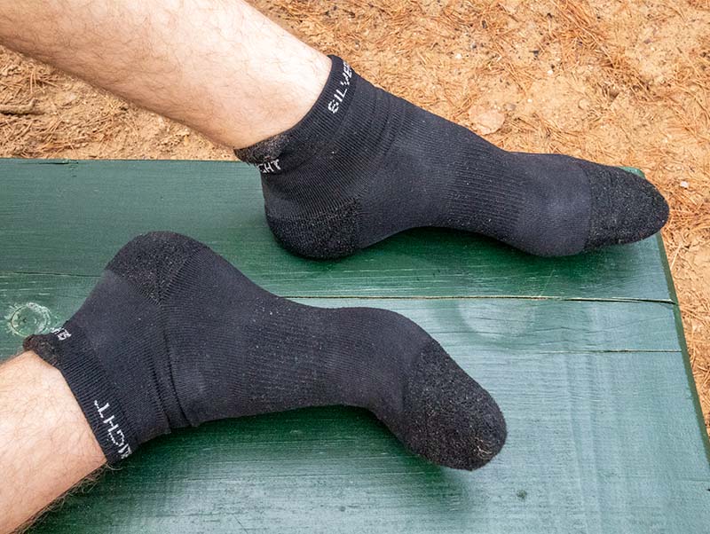 A hiker wearing no-show hiking socks with ankle-heel flaps
