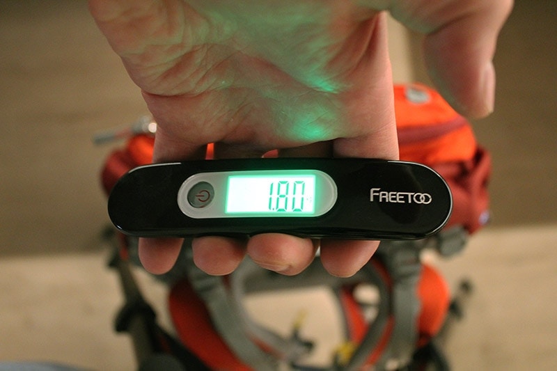 Weighing the Mountaintop backpack with a luggage scale